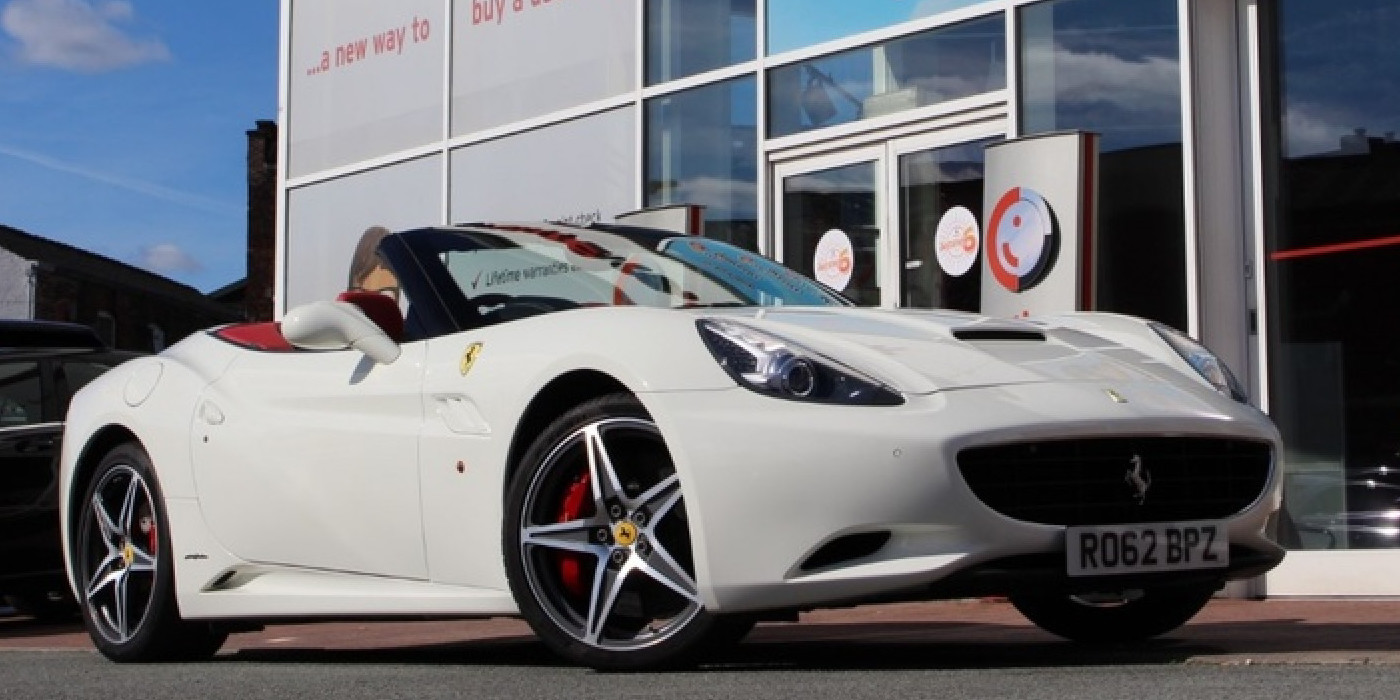 White Ferrari California parked three-quarters facing right